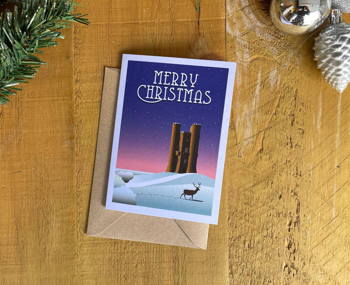 Broadway Tower Christmas card on table