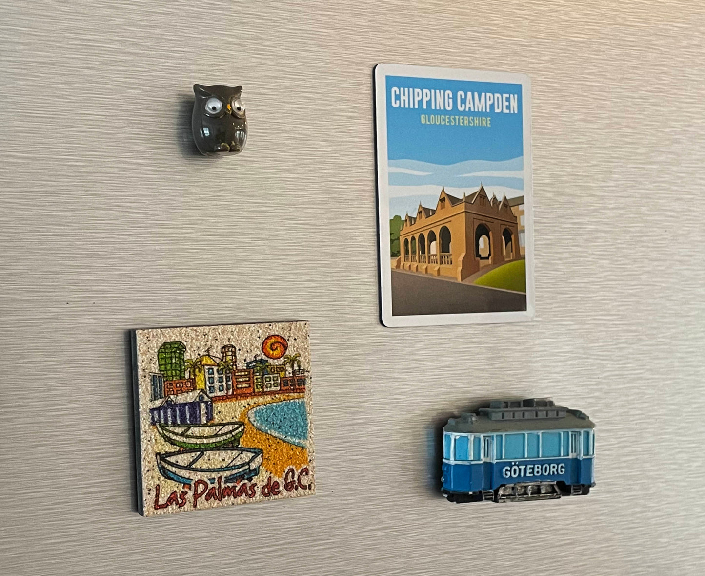 Chipping Campden magnet on fridge with other magnets