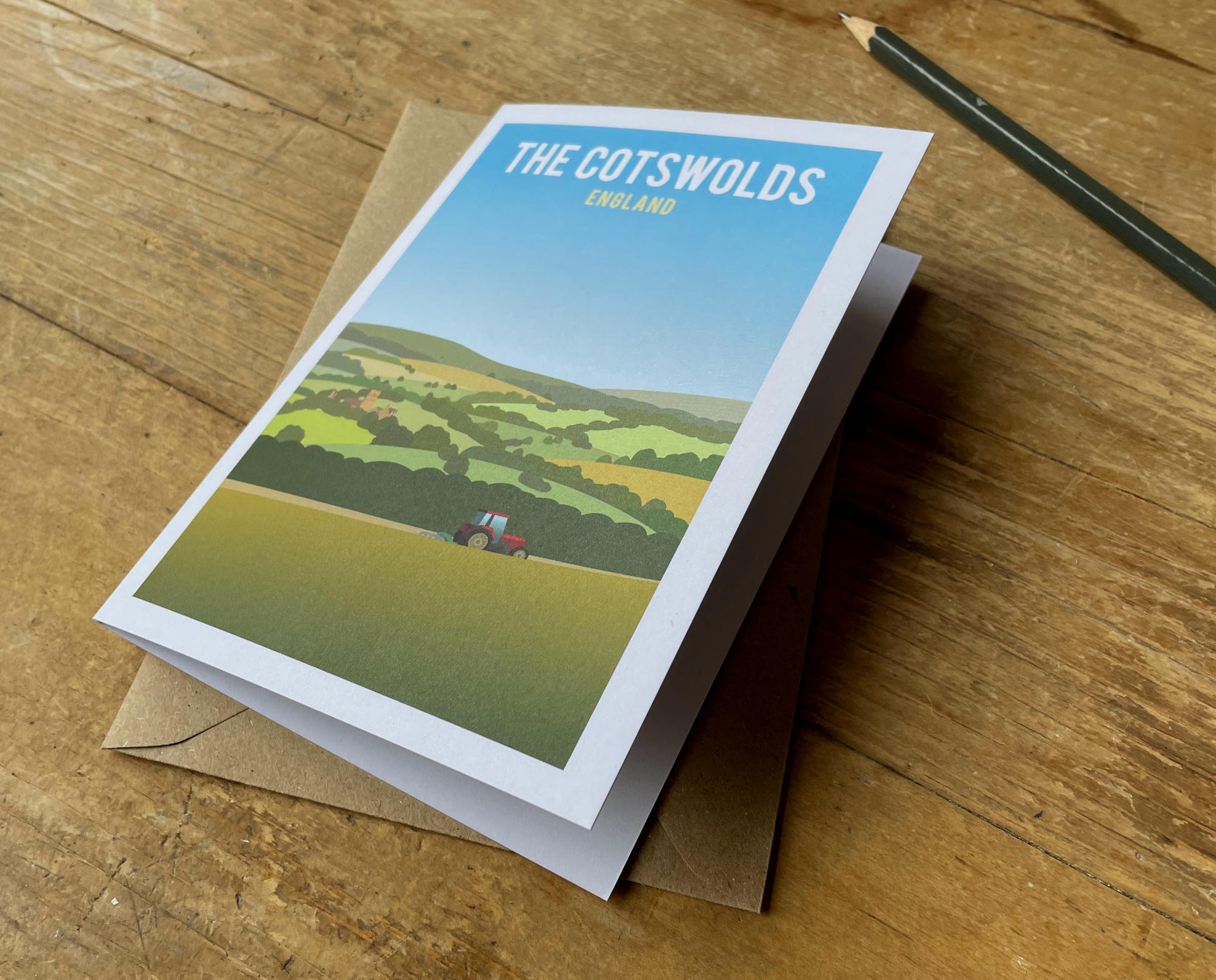 Cotswold Hills Tractor Greeting Card on desk